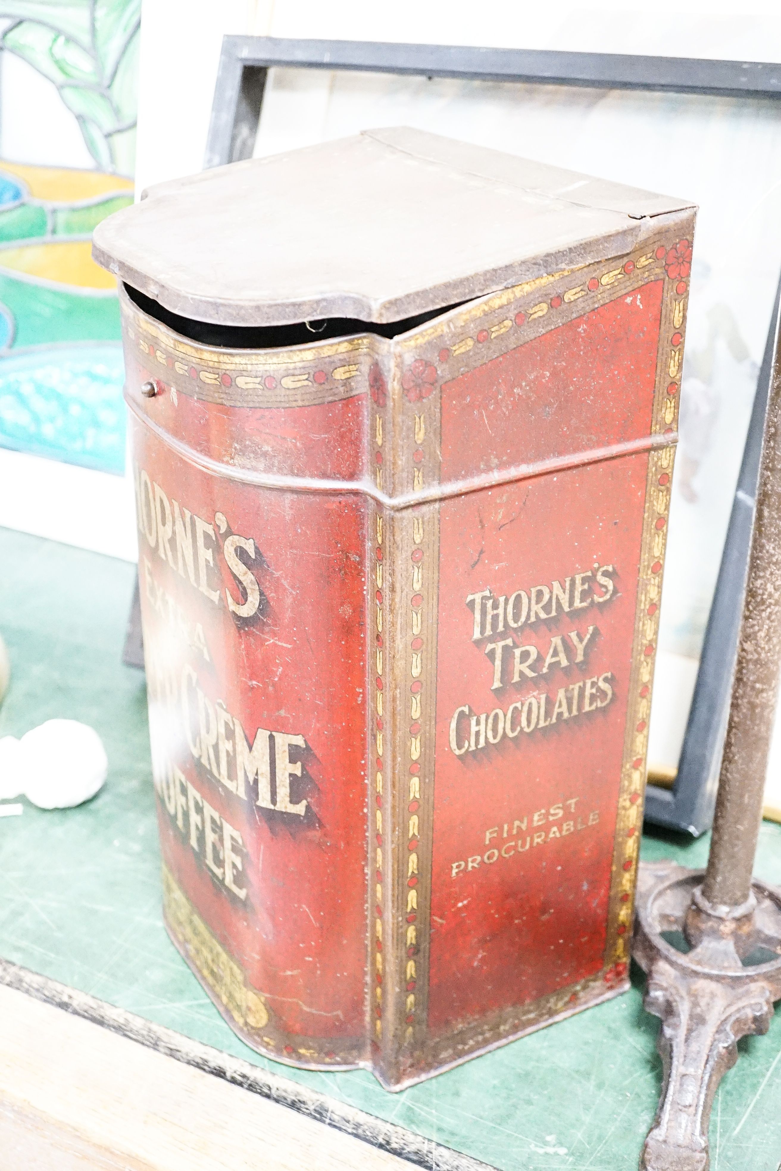 A mannequin on cast iron stand, height 103cm, and a retailer's Thorne's Toffee can